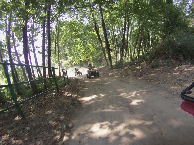  On a quad along the fenced path 